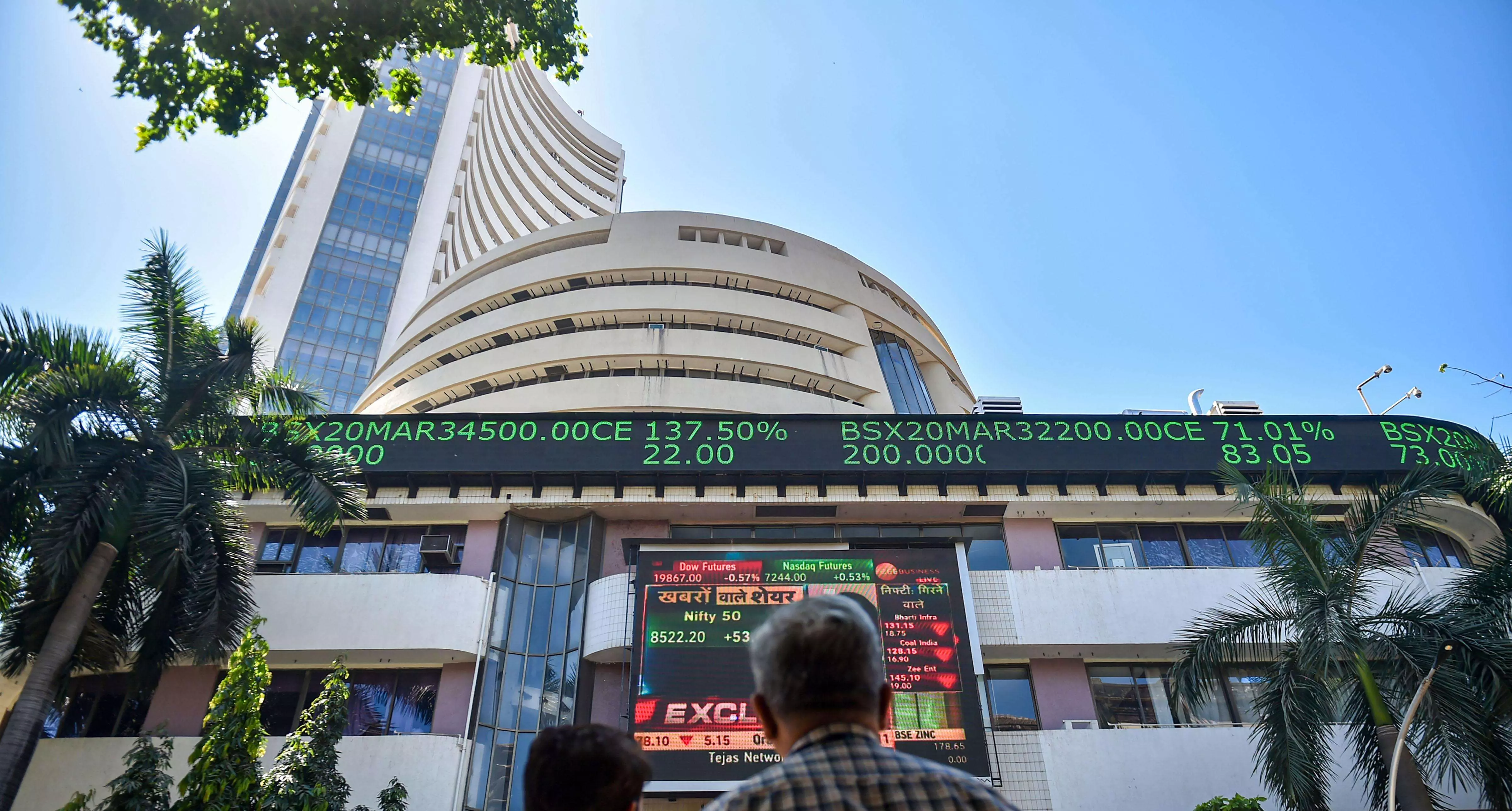 Sensex, Nifty settle flat after hitting fresh lifetime high levels in early trade