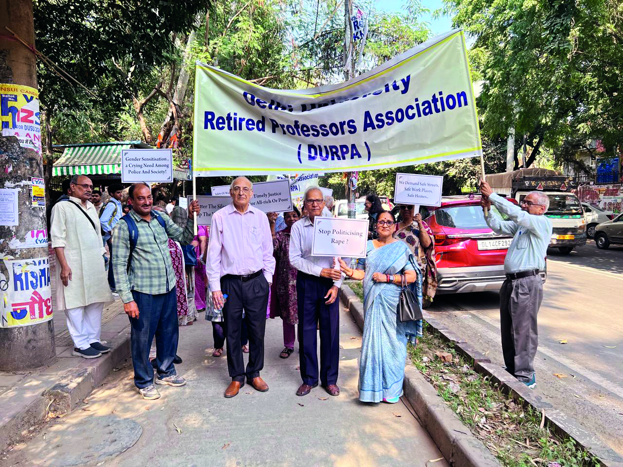 Retired Delhi Univ Professors lead silent march protesting rising sexual violence