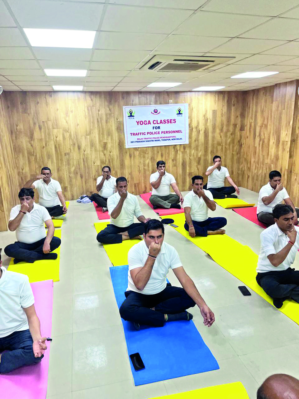 Yoga session for traffic police personnel held to counter pollution’s health effects