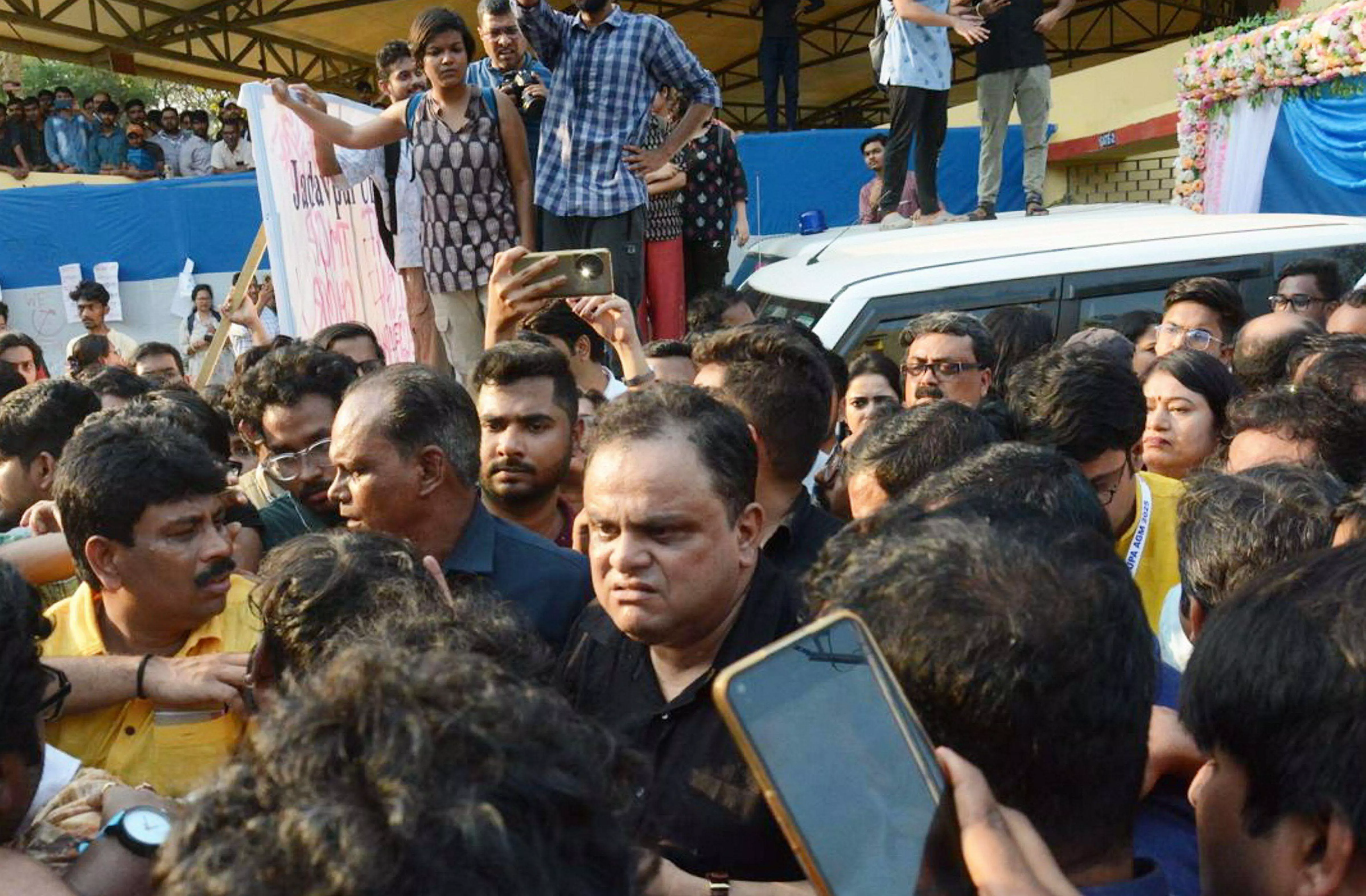 SFI members gherao Bengal education minister JU campus, damage car