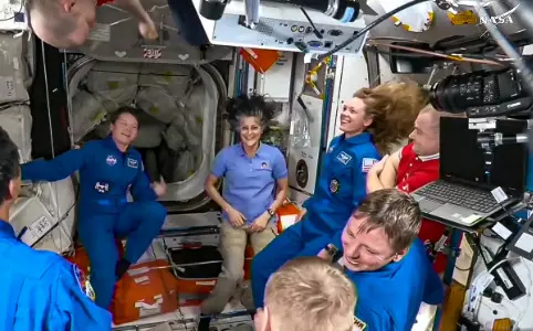 NASAs stuck astronauts welcome their newly arrived replacements to space station