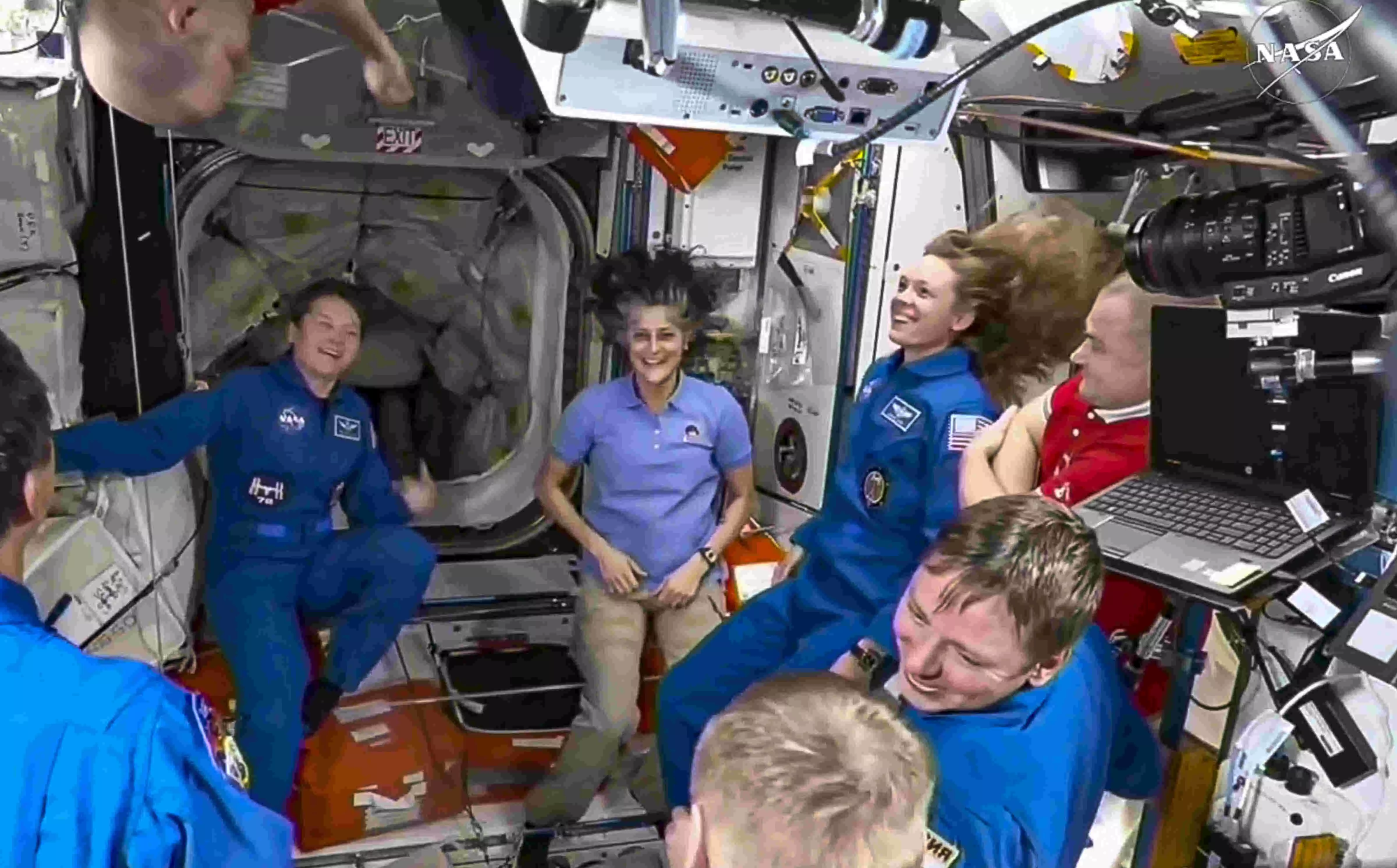 NASAs stuck astronauts welcome their newly arrived replacements to the space station